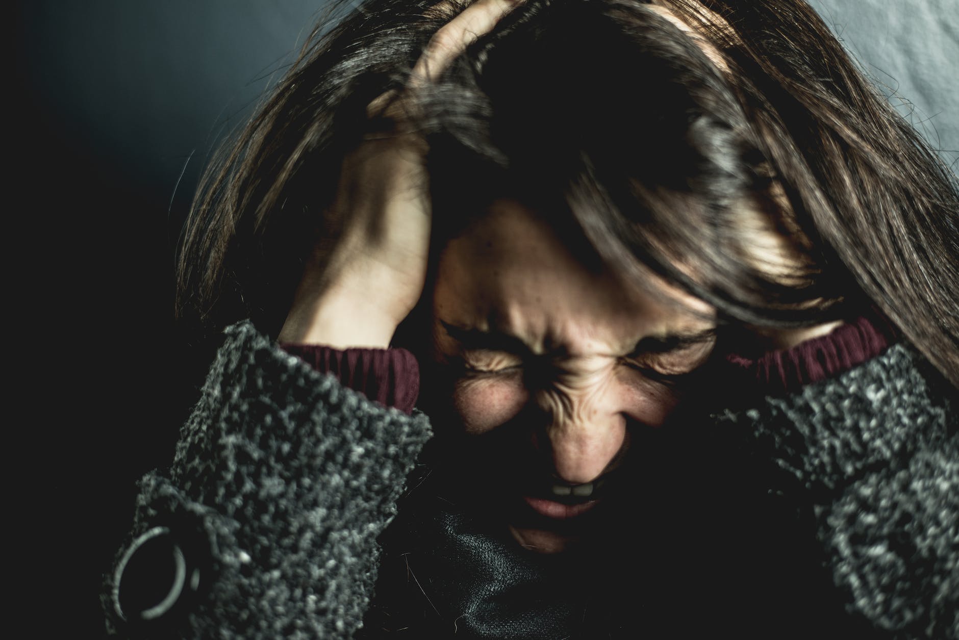 Tuning Into Your Emotions - woman holding her head