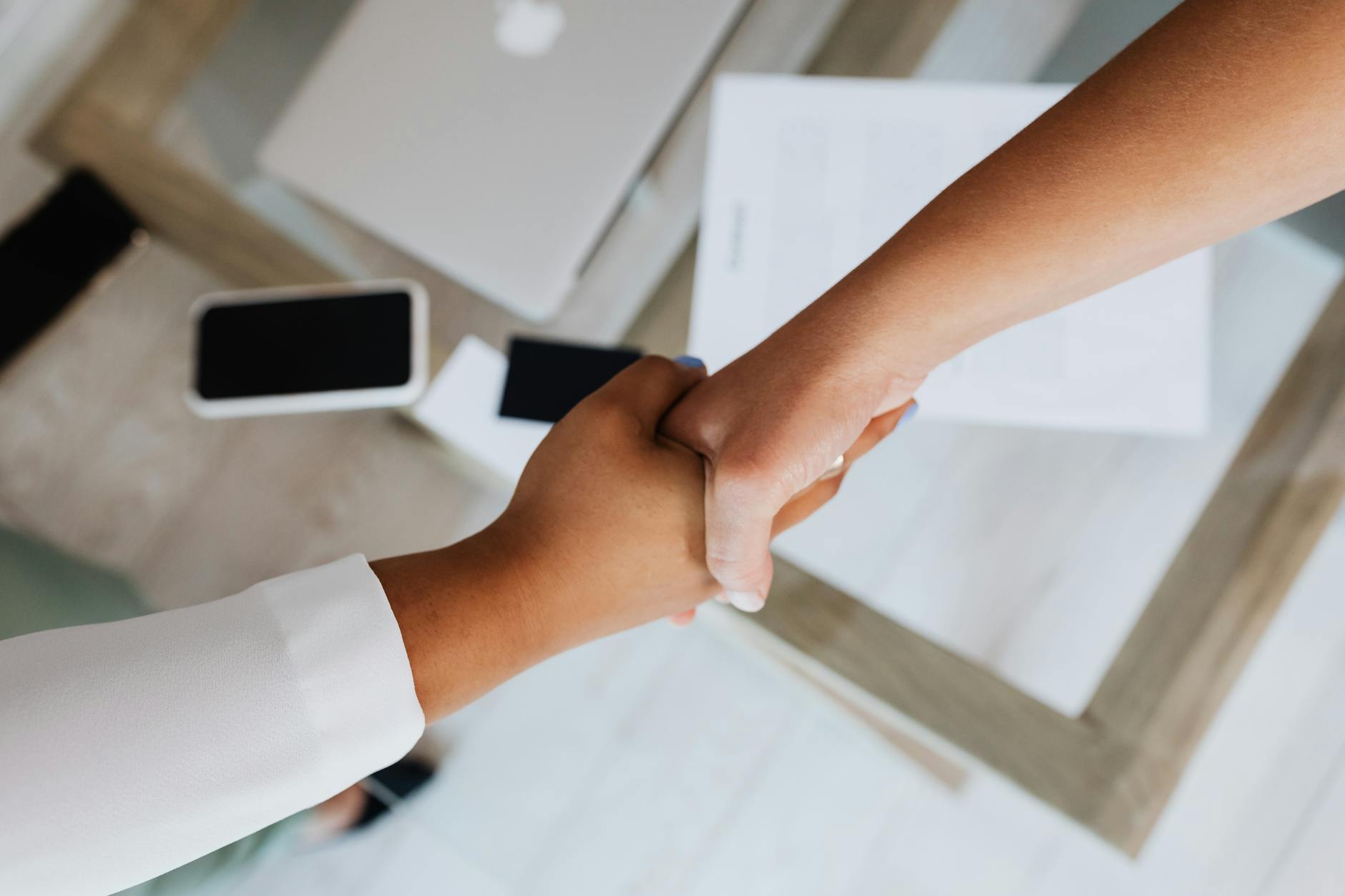 Discover Your True Values - two people doing a handshake