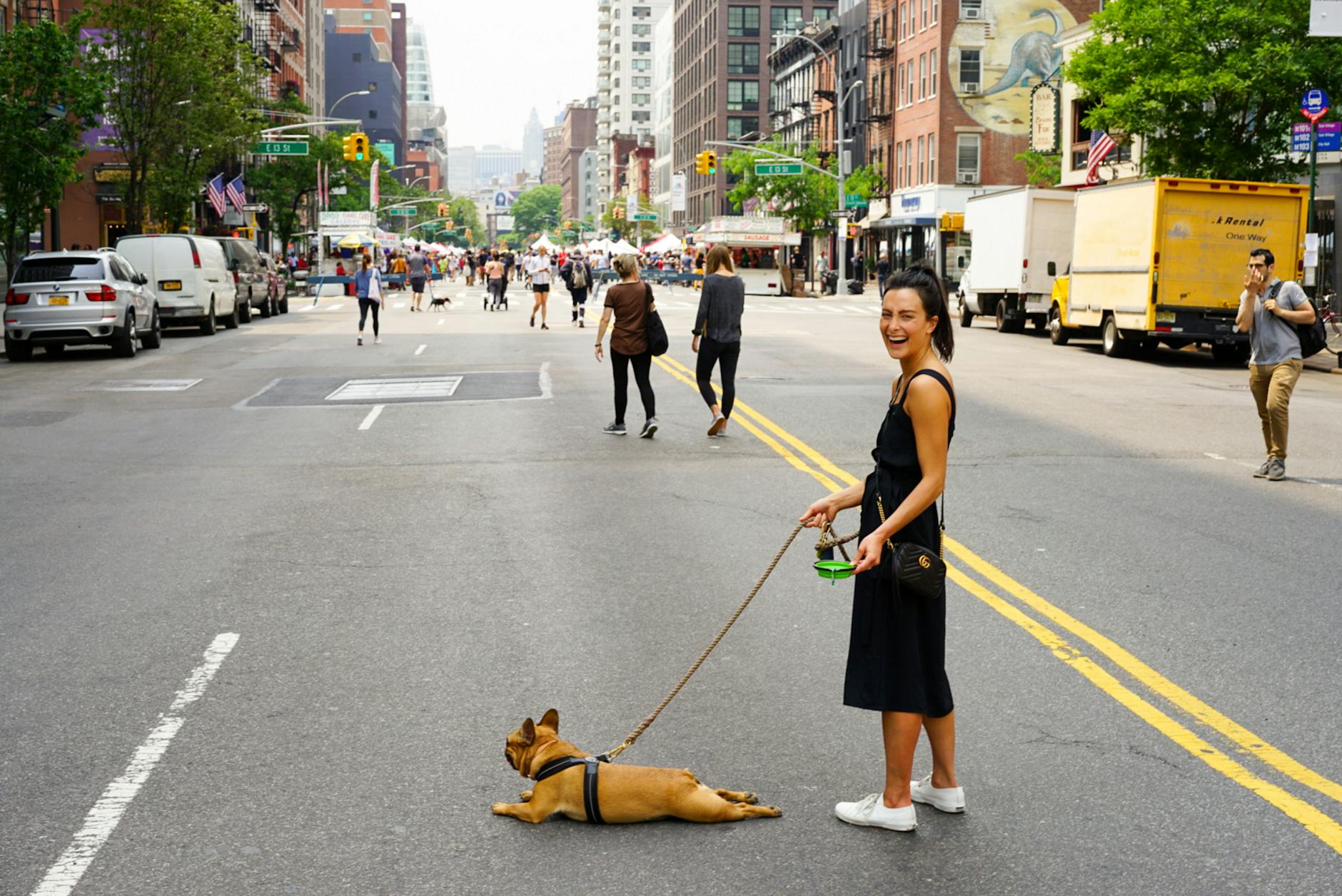 Boost Your Self-Esteem woman with dog at the middle of the street